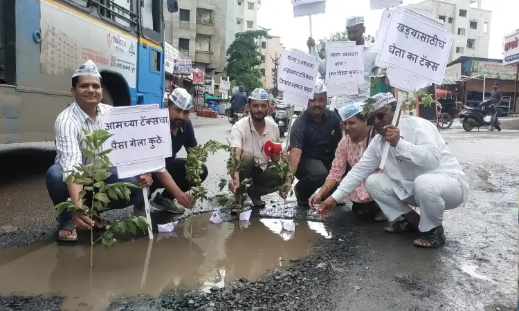 Pune News | PMC constructed roads turns into potholes, AAP protested by planting trees in potholes
