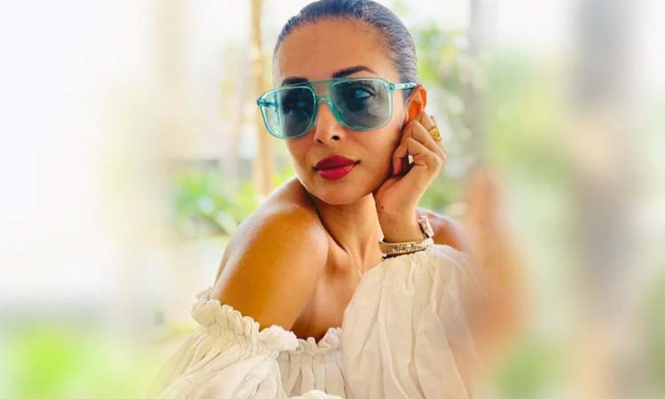 malaika arora in white off shoulder white top grabs attention with cool shades