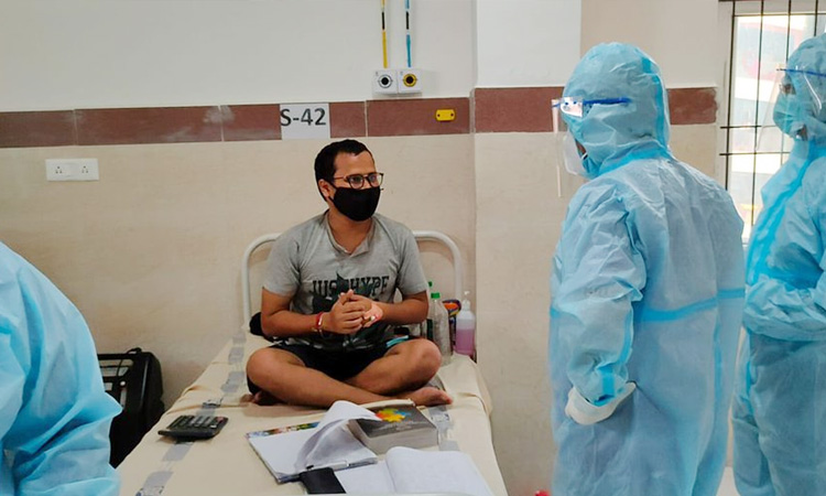covid patient preparing ca exam his hospital bed odisha ias praises him see viral photo