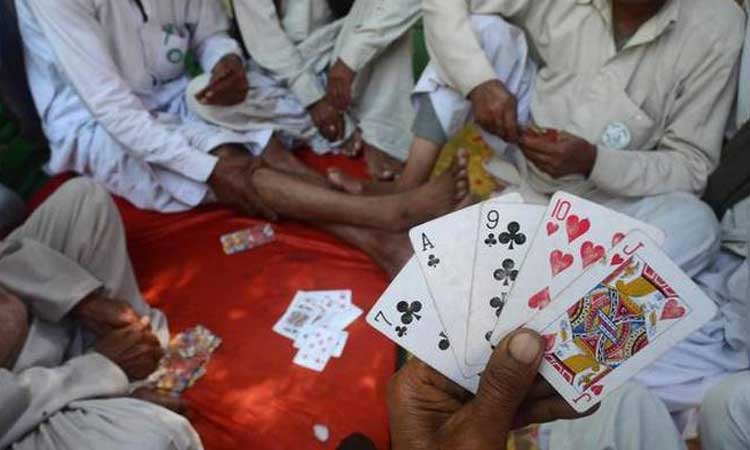 police raid gambling den seize thousands items