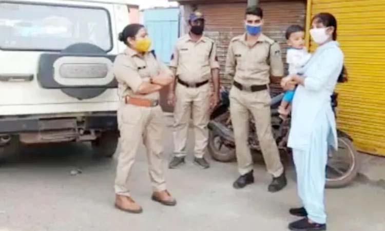 woman police constable duty baby lap guna madhya pradesh