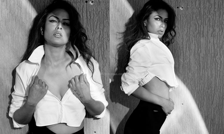 Nia Sharma Hot Photos | nia sharma looking sensuous in white shirt black jeans nia flaunts her figure in open shirt photos viral on social media